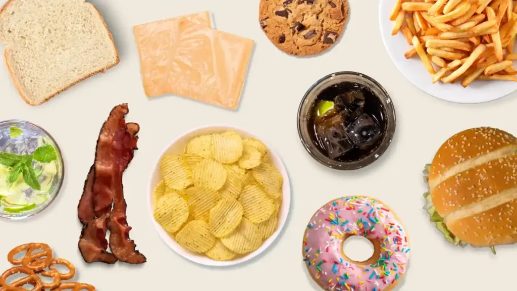 A top-down view of various junk foods to avoid in piles